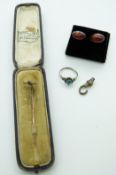 A 9ct gold stick pin in vintage Worcester jewellery box, silver ring and pressed amber earrings