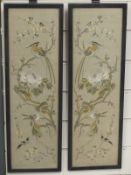 A framed pair of 19thC Chinese embroidered cuffs 54cm x 17cm