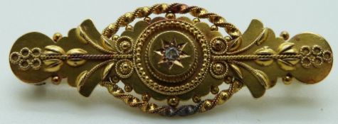 Edwardian 15ct gold brooch set with a diamond, 4g