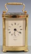 Twentieth century brass carriage clock by Rapport, London, with ivory coloured Roman dial and