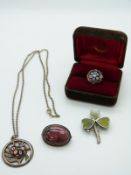 A silver pendant set with a millefiori cabochon by Caithness, a similar ring, a silver clover brooch