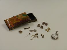 A collection of cufflinks including a silver pair with feature hallmarks, silver tie clip, a