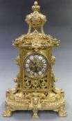 Nineteenth century brass mantel clock, ornate brass dial with cabouchon Roman numerals beetle and