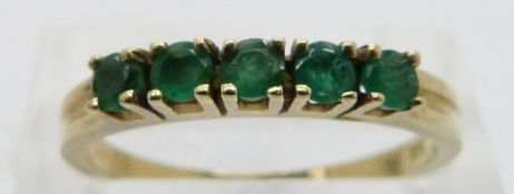 A 14ct gold ring set with emeralds, size P