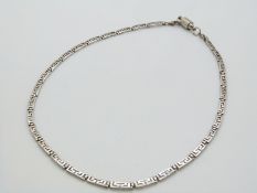 A silver Greek key necklace