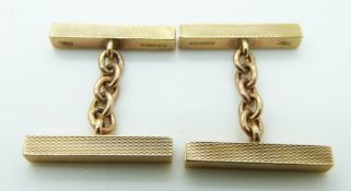 A pair of 9ct gold cufflinks made up of rectangular engine turned sections, 4.7g