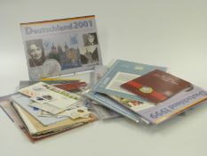 A collection of German coin and stamp commemorative covers, celebrating sport, historical and
