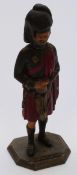 Spelter cold painted table lighter in the form of a Scottish Highland soldier, 23cm tall