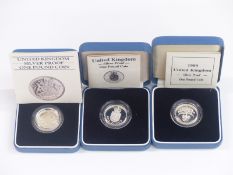 Three cased silver proof £1 coins 1983, 1988 and 1989
