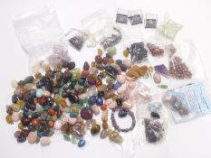 A collection of agate stones/ pebbles including amethyst, rose quartz, emerald etc