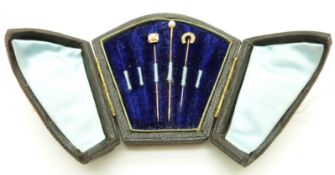 Three Victorian stick pins set with pearls, in original box.