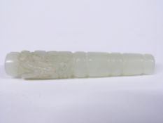 A 19thC carved jade mirror handle with dragon decoration, length 8.3cm