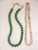A pink cultured pearl necklace and an agate necklace