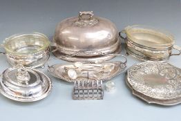A quantity of silver plate including large meat dome, serving dishes, glass lined dishes, cutlery