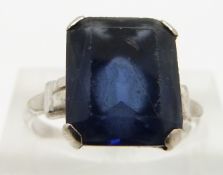 A 10k white gold ring set with blue paste, size L