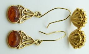 A pair of yellow metal earrings in the form of shells and a pair of 9ct gold earrings set with