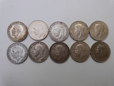 Ten English crowns comprising nine 1935 George V 'rocking horse' examples and a 1951 George VI