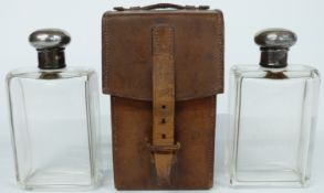 George V leather cased pair of hallmarked silver mounted glass flasks by J.G.Vickery, Regent St,