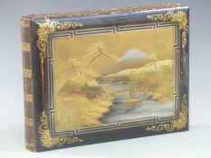 Japanese lacquered postcard album with mount Fuji landscape scene to cover and hard decorated pages,