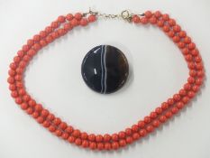 A double strand glass necklace made to look like coral with 9ct gold clasp and a Victorian banded