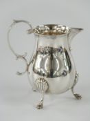 Elizabeth II hallmarked silver jug raised on three feet, Sheffield 1965 maker Francis Howard Ltd,