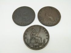 1874 Victorian later young head bronze penny together with an 1875 and an 1878 example, dark tone,