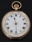 A 9ct gold keyless winding open faced pocket watch with gilt decorated and gem set white enamel