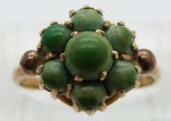 A 9ct gold ring set with a cluster of turquoise, size O