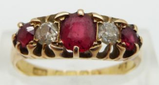 An 18ct gold ring set with two diamonds and red paste,  Birmingham 1890, size N