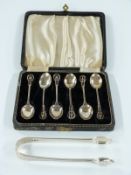 A cased set of six hallmarked silver teaspoons with pierced design, Birmingham 1944 together with