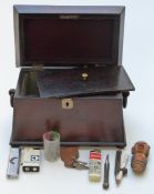 A 19thC rosewood sarcophagus shaped two division tea caddy with loop handles, raised on ball feet, H