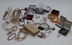 A collection of costume jewellery including earrings, brooches etc