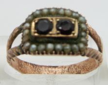 A Georgian ring set with seed pearls and two garnets in foiled setting with receipt, size Q/ R
