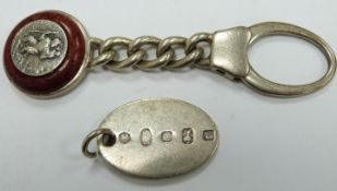 Two hallmarked silver keyrings/fobs, one with feature hallmarks, the other with applied St