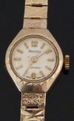 Regency 9ct gold ladies wristwatch with gold hands and baton markers, cream dial and signed 17 jewel