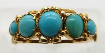 Victorian yellow metal ring set with graduated turquoise cabochons, size M
