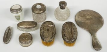 A quantity of hallmarked silver dressing table items with hammered decoration comprising hand