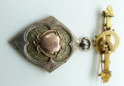 A 9ct gold bar brooch depicting a swallow, Birmingham 1887, and a silver fob with applied gold