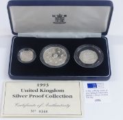 Royal Mint deluxe cased UK silver proof collection comprising a crown, one pound and fifty pence,