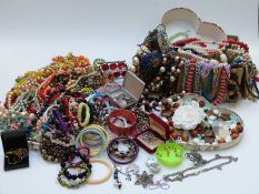 A collection of costume jewellery including earrings, beaded necklaces, silver pendant set with an