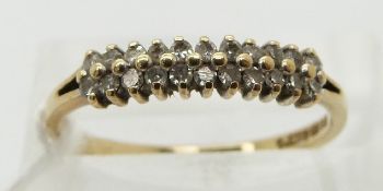 A 9ct gold half eternity ring set with diamonds in two rows (size N)