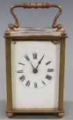 Late 19th/early 20thC French brass carriage clock, the white enamel Roman dial with spade hands,