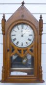 Nineteenth century probably American wall clock in Oak steeple style case. Thew pattern Roman dial