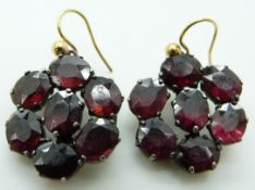 A pair of Victorian earrings set with foiled oval garnets