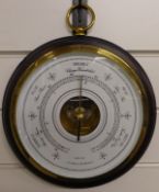 A circular 20thC aneroid barometer by Les Ateliers LM a Bordeaux, the white enamel dial with French,