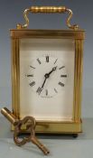 Twentieth century brass carriage clock by Lionel Peck of London, with white Roman dial and