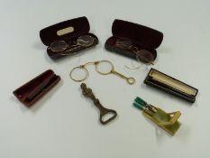 Three pairs of spectacles with gold plated rims and two cheroot holders