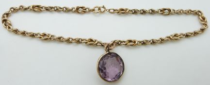 A 9ct gold necklace made up of knotted links with a pendant carved with an intaglio