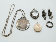 A mounted Maria Theresia coin, a silver necklace, a pair of filigree earrings, a Victorian locket, a