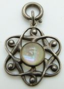 Arts and Crafts silver pendant set with a moonstone cabochon